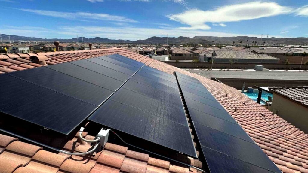 Solar panels installed on a Las Vegas rooftop under clear skies.