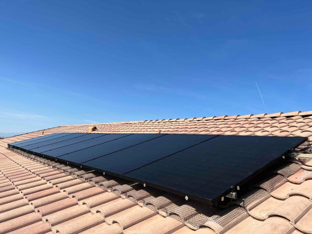 Completed solar panel installation by Bob's Repair on a Las Vegas residential tile roof against a clear blue sky