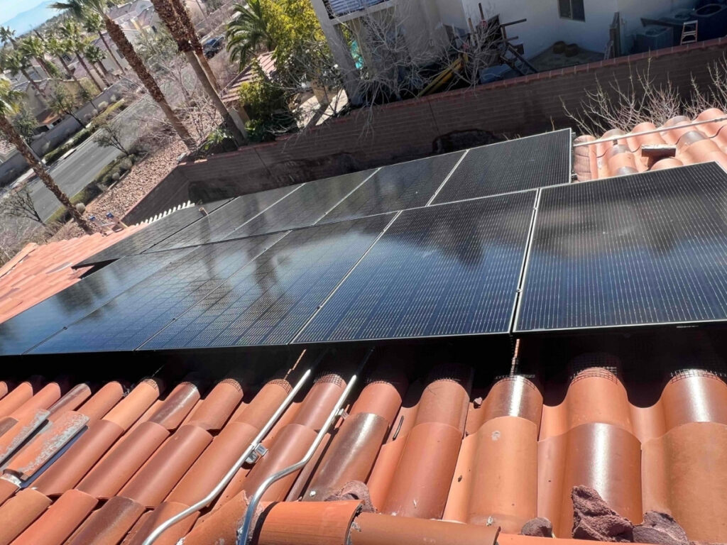 Tier-1 desert solar panels mounted on elevated racking above a tile roof in Las Vegas, showing the airflow gap that reduces roof deck heat by up to 38 percent